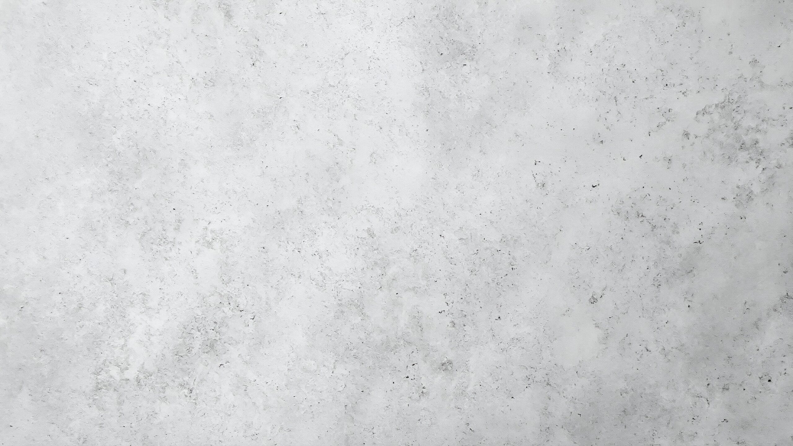 A textured gray background with subtle variations, suitable for design or artistic purposes.