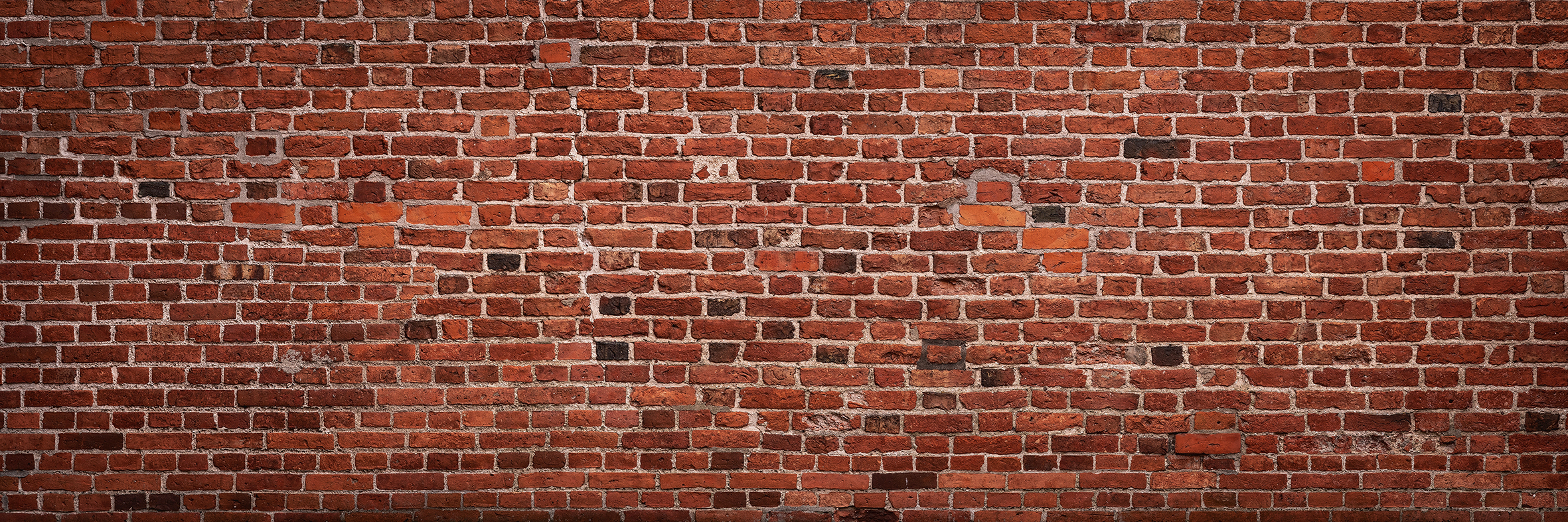 Panoramic view of empty, old, red brick wall background with cop